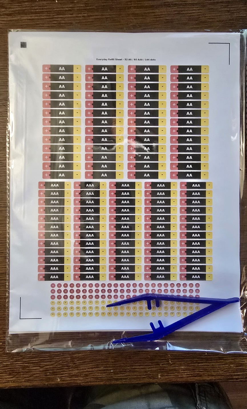 BatteryBright refill label sheet packaged with installation tweezers